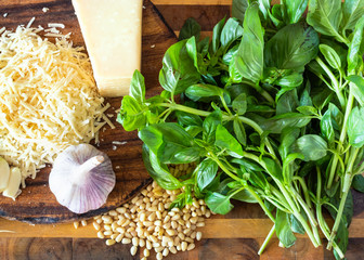 Pesto ingredients on wooden board