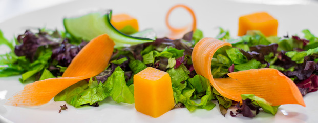 Salad preparation on chef's table