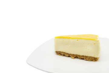 Lemon lime cheesecake on the white plate isolate on white background
