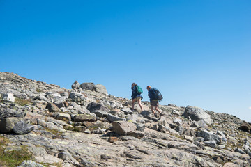 couple hiking on Besseggen ridge in Jotunheimen National Park, Norway