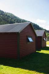 Fototapeta premium two houses near mountains in Gudvangen, Neirofjord, Norway