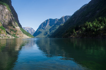 Naklejka na ściany i meble scenic landscape with lake and mountains in Gudvangen, Neirofjord, Norway