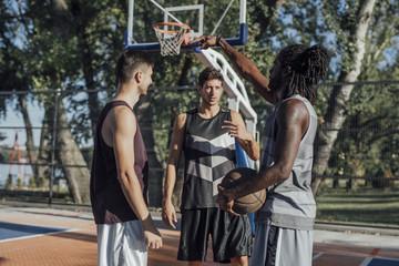 Obraz na płótnie Canvas Friends Playing Basketball
