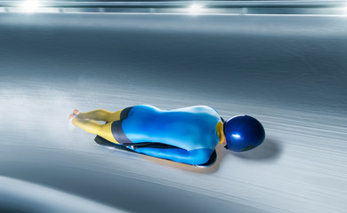 Skeleton sport. The athlete descends on a sleigh on an ice track. Winter sports. Bobsled. Luge