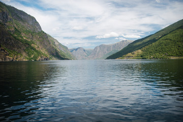 beautiful landscape with majestic mountains and calm water of Aurlandsfjord, Flam (Aurlandsfjorden), Norway