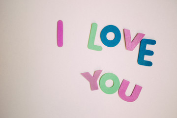 Colorful letters I love you on the light background, top view