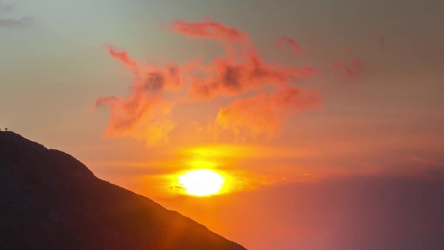 timelapse of a firey vivid sunset in the picos de europa, asturia, spain