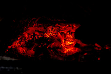 Fototapeta na wymiar Burning Embers in a Country Wood Stove