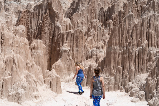 Two female hikers start their hike in Cathedral Gorge State Park. Concept for adventure, female friendship