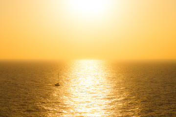 ocean sea and boat view at sunset from mediteranean greek cycladic island paros
