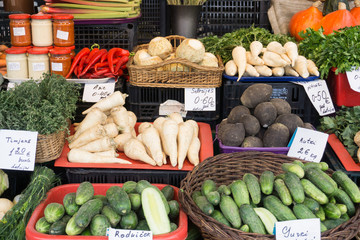 Fresh vegetables on stands of market in autumn