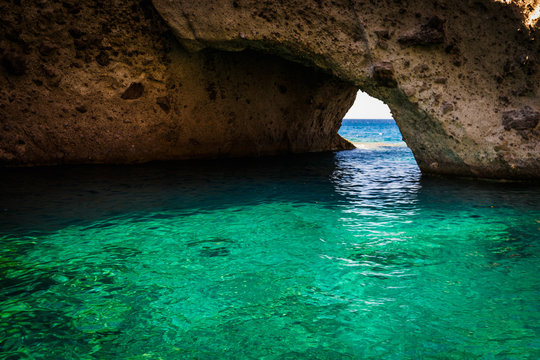 cave and blue water near anti paros greek cycladic island 2