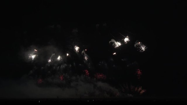 Colorful fireworks on black sky background stock footage video