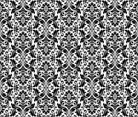 Wallpaper in the style of Baroque. Seamless vector background. White and black floral ornament. Graphic pattern for fabric, wallpaper, packaging. Ornate Damask flower ornament