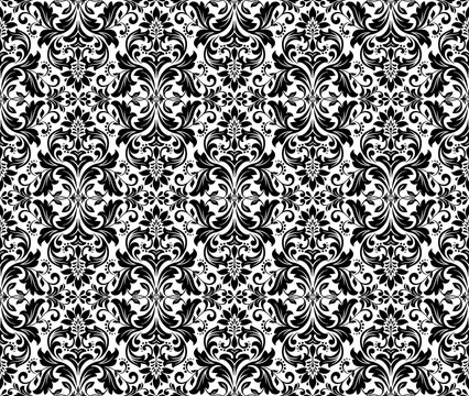 Wallpaper in the style of Baroque. Seamless vector background. White and black floral ornament. Graphic pattern for fabric, wallpaper, packaging. Ornate Damask flower ornament