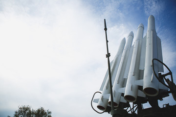 Four missiles against clear blue sky. Weapon are ready to war. Copyspace