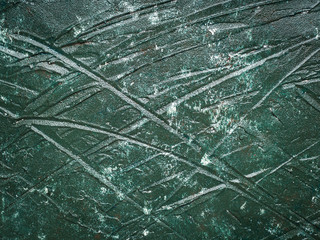 Dark green acrylic painted wooden background with rough texture