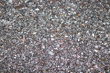 Gravel on the ground usable for background. Grey red colors.