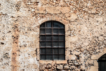 Old window in stone wall