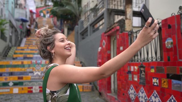 Happy beauty young brazilian woman taking a selfie photo in a famous and culture turistic place in Rio de Janeiro, Brazil