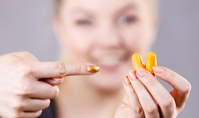 Woman holding protective earplugs