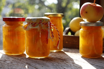 Apple confiture with orange in Mason glass jars
