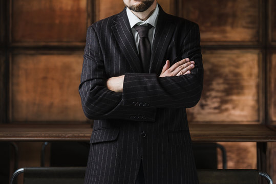 elegant man in suit on the wooden luxury background