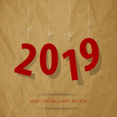 Paper 2019 digits red on a crumpled paper brown background.