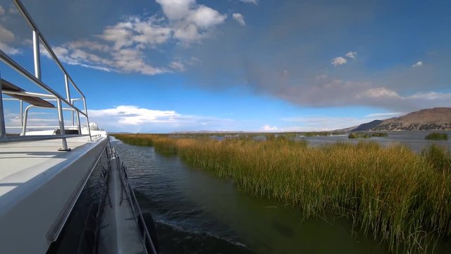 The Tourist boat sailing in Titicaca lake near Puno, Peru