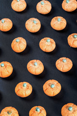 marshmallows in the shape of a pumpkin for the holiday Halloween on a black background.  