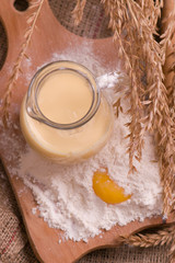 Spikelets of wheat, eggs, milk, flour. Ingredients for bakery products