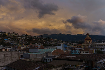Vulcano in the background of the cityscape of otavalo, ecuador