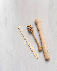 Wooden kitchen tools on a neutral background