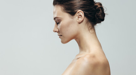 Pretty young brunette with her eyes closed