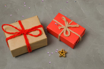 Christmas gift wrapped in paper and tied with red thread. New years day, womens day.