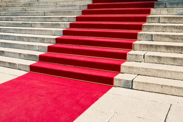 Luxorious noble red carpet on the historical stairs