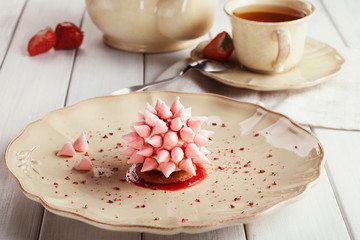 Pink restaurant dessert on porcelain plate