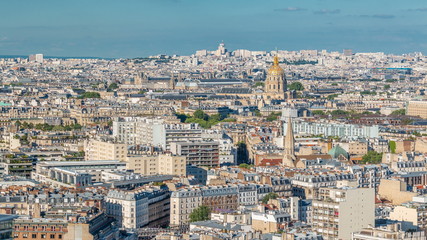 Fototapeta na wymiar Aerial panorama above houses rooftops in a Paris timelapse