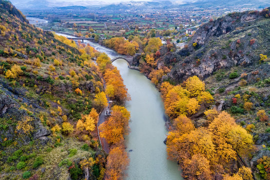 Aerial view of Konitsa old bridge and Aoos River an autumn day, Greece.