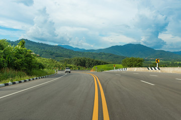 On hill asphalt road and blue sky nature landscape