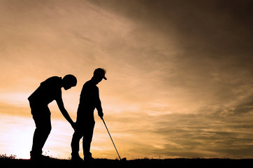 Silhouette golf athletes and coaches with the sky beautiful sunsets