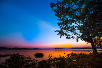 Fototapeta na wymiar Beautiful blue twilight sky over clam lake at dawn for background