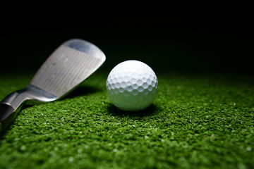 Golf clubs and golf balls is on the Putting Green