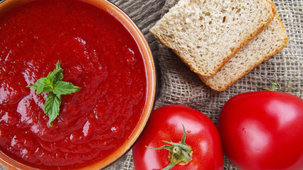 Delicious tomato cream soup on the table.