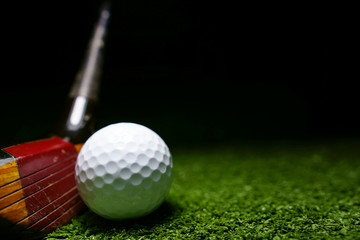 Golf clubs and golf balls is on the Putting Green