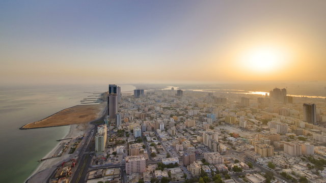 Sunrise and morning with Cityscape of Ajman from rooftop timelapse. Ajman is the capital of the emirate of Ajman in the United Arab Emirates.