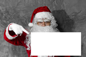 Naklejka premium Santa Claus is pointing the finger at white space