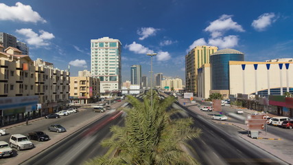 Fototapeta na wymiar Cityscape of Ajman from bridge at day timelapse. Ajman is the capital of the emirate of Ajman in the United Arab Emirates.