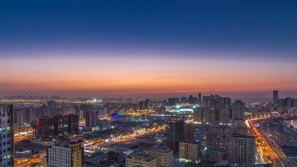 Cityscape of Ajman from rooftop day to night timelapse. Ajman is the capital of the emirate of Ajman in the United Arab Emirates.