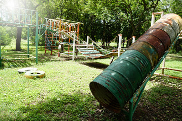 Playground equipment is old and worn in the park